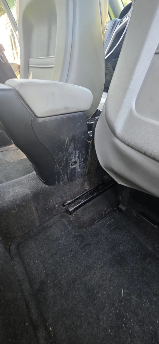 Console and carpet with built-up dirt and grime